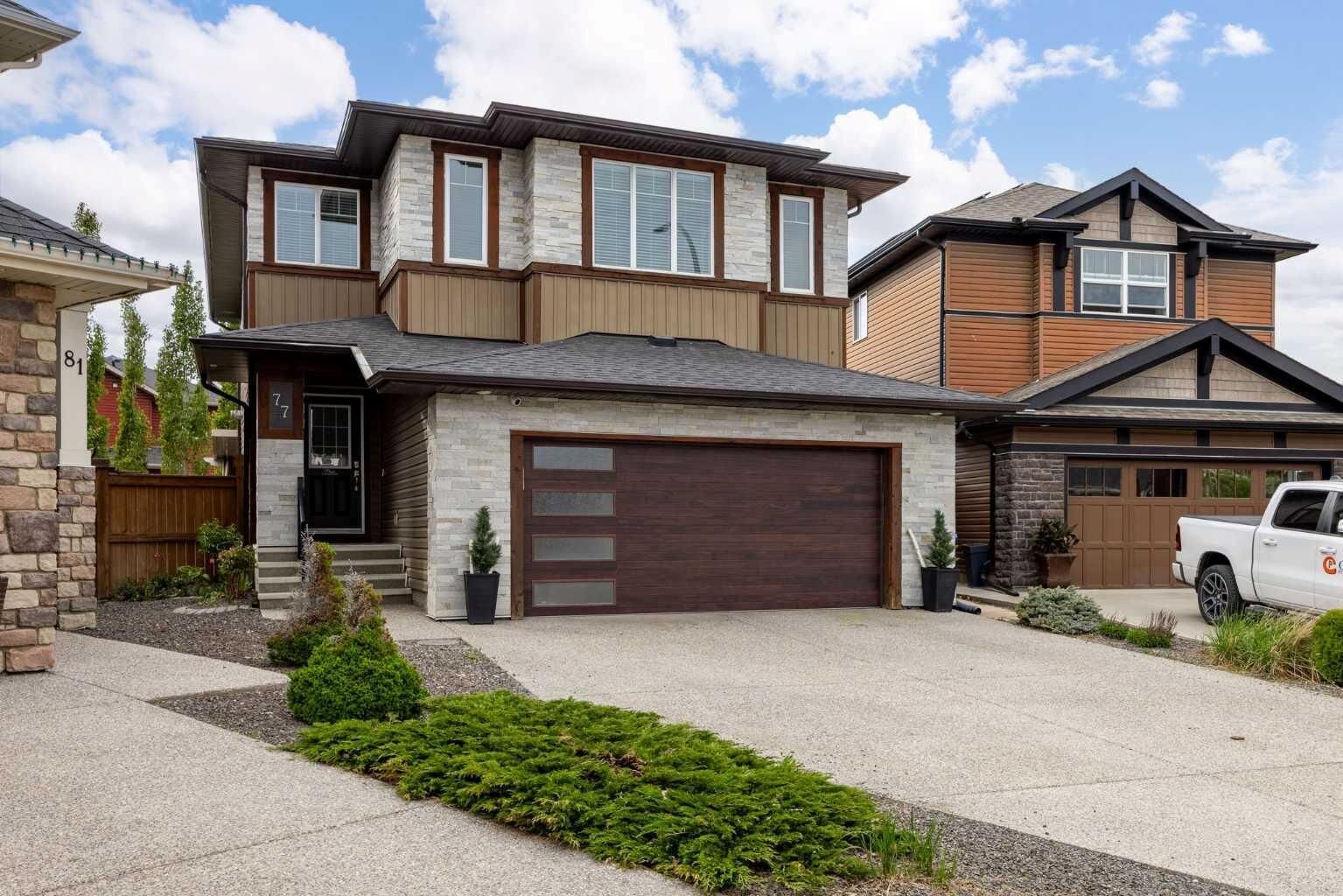 Property Photo:  77 Cougar Ridge Cove SW  AB T3H 0S5 
