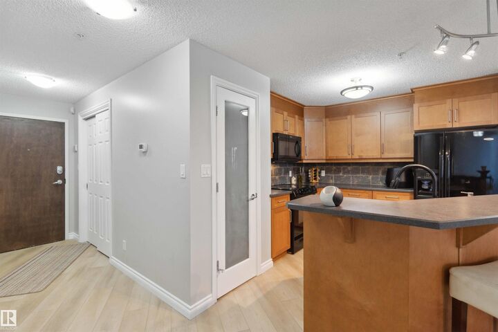 Property Photo:  9020 Jasper Avenue NW 402  AB T5H 3S8 