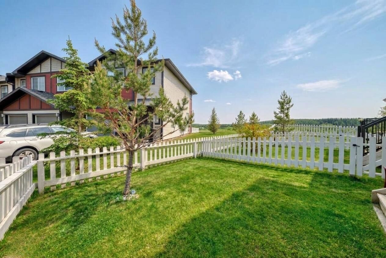 Property Photo: 1402 Jumping Pound Common AB T4C 2L1