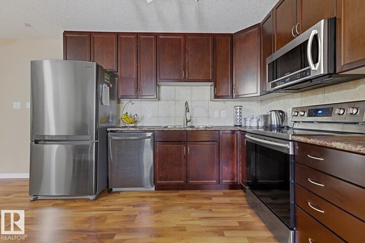 Property Photo: 1204 156 Street NW 211 AB T6R 0R6