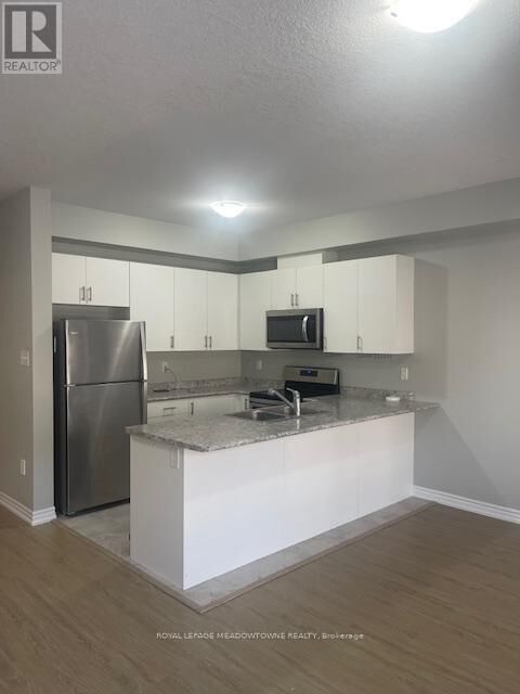 Property Photo: 88 Decorso Drive 29 ON N1L 0A1