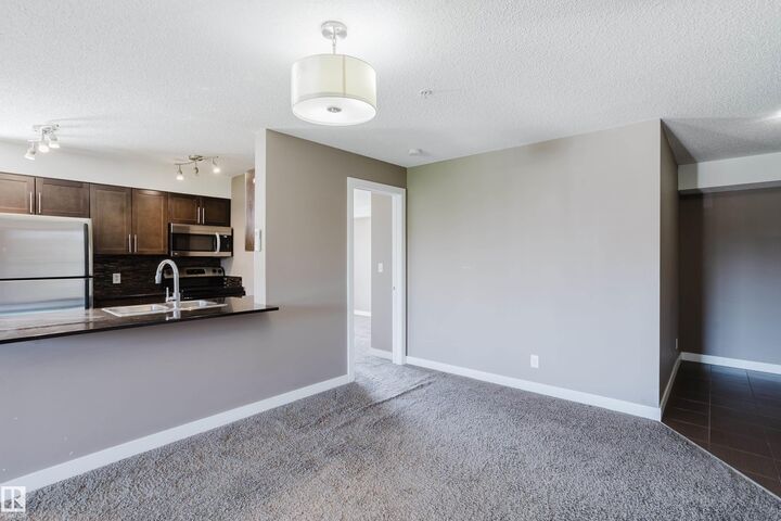 Property Photo: 11820 22 Avenue SW 301 AB T6W 2A2