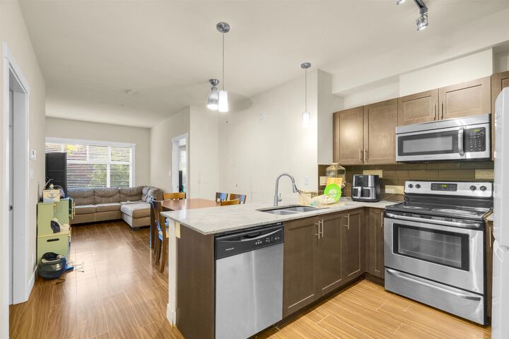Property Photo: 13468 King George Boulevard 110 BC V3T 0H5