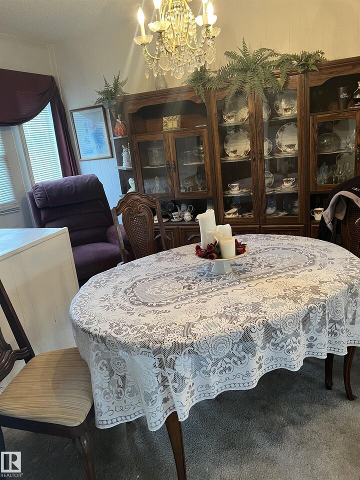 Property Photo:  10912 132 Street NW  AB T5M 1B4 