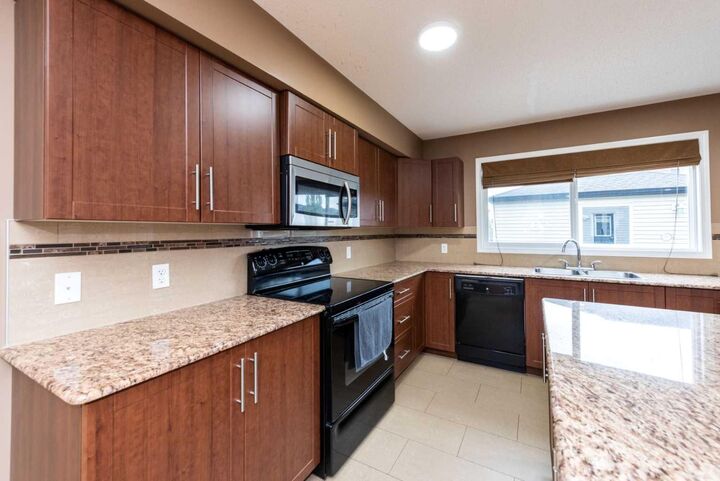 Property Photo: 212 Panatella Drive NW AB T3K 0T4