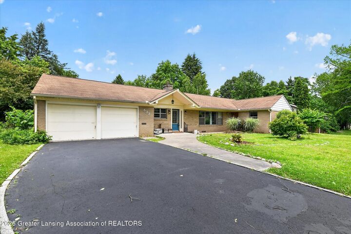 Property Photo:  637 Whitehills Drive  MI 48823 