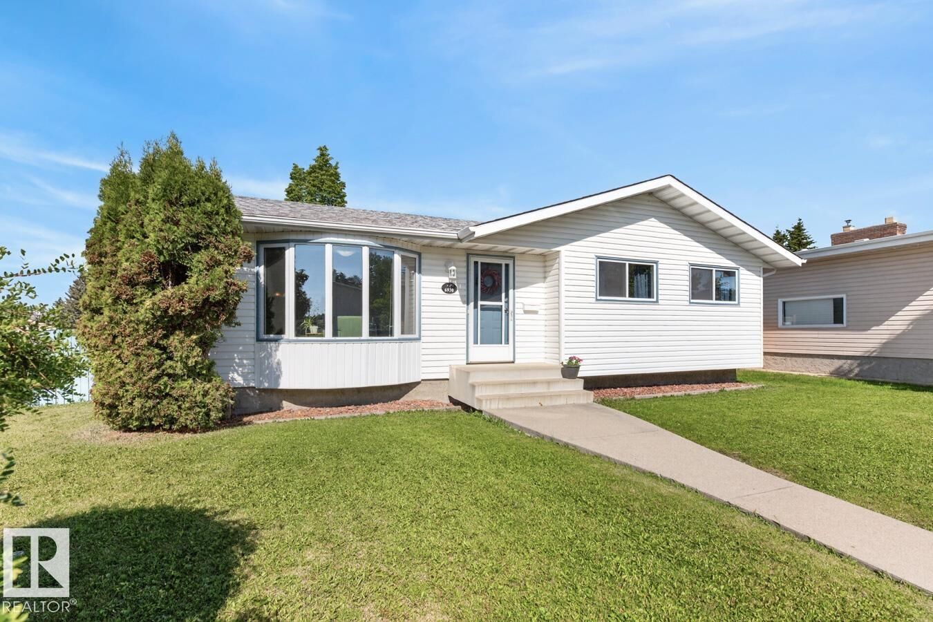 Property Photo:  6930 11 Avenue NW  AB T6K 3J5 
