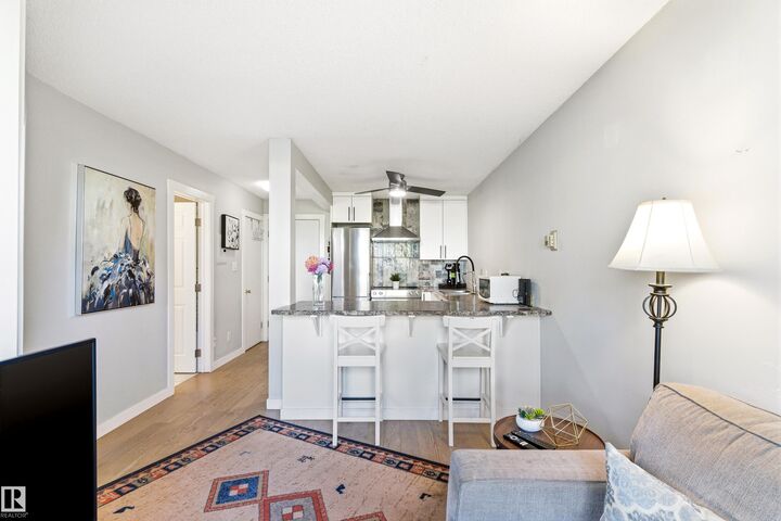 Property Photo:  10230 120 Street NW Street NW 105  AB T5K 2A3 