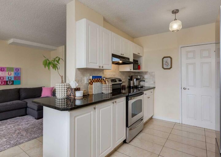 Property Photo: 7007 4A Street SW 213 AB T2V 1A1