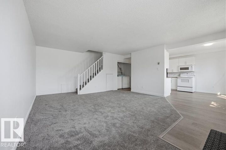 Property Photo:  14530 52 Street NW 105  AB T5A 3K5 