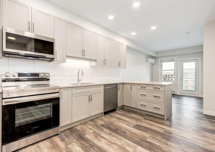 Property Photo: 125 Wolf Hollow Crescent SE 408 AB T2X 5W9