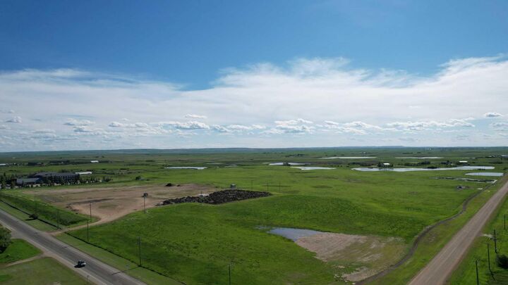 Property Photo: 605 Palliser Trail AB T0J 1P0