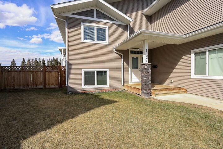 Property Photo: 137 Coachman Way AB T4M 0B4