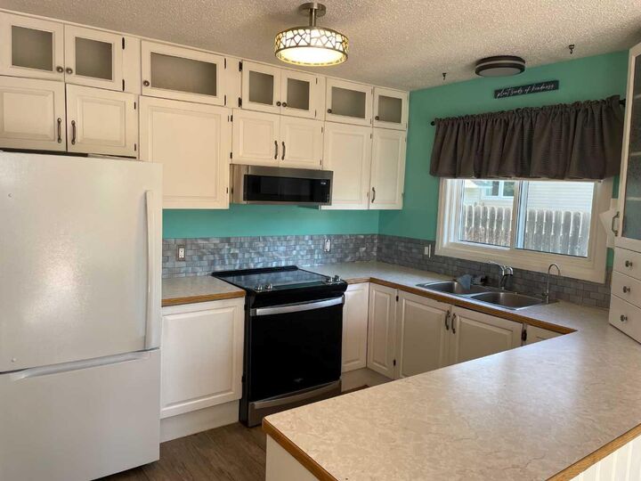 Property Photo:  11409 110 Ave. Cres  AB T0H 1L0 