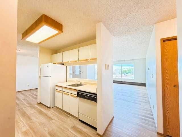 Property Photo: 201 12 Avenue SW 306E AB T0G 2A4
