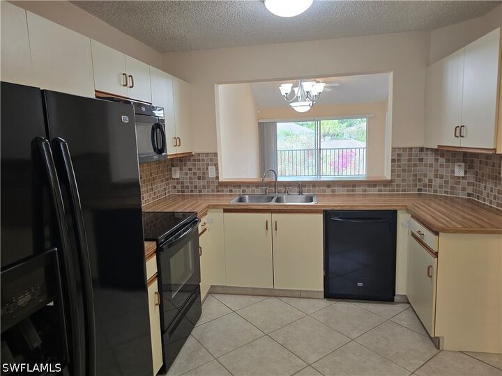 Property Photo:  5741 Whitaker Road D203  FL 34112 