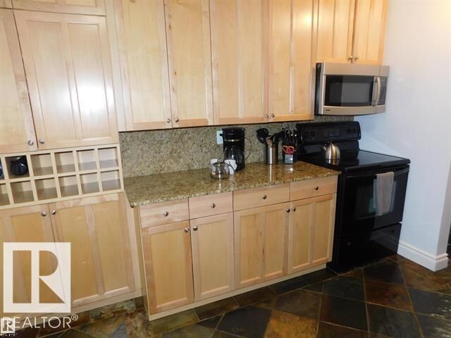 Property Photo:  10745 83 Avenue NW 101  AB T6E 2E5 
