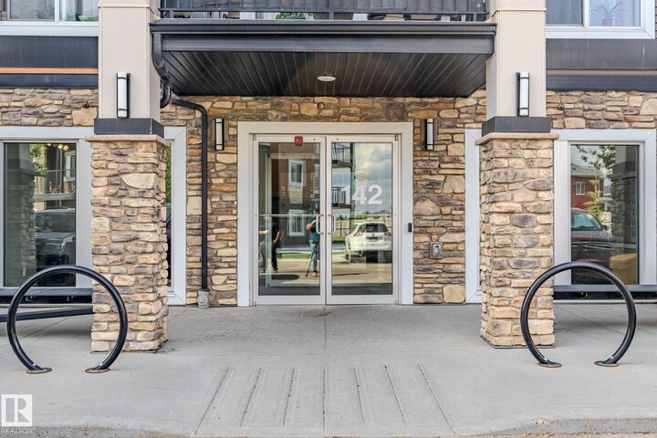 Property Photo: 142 Ebbers Boulevard NW 107 AB T5Y 3W2