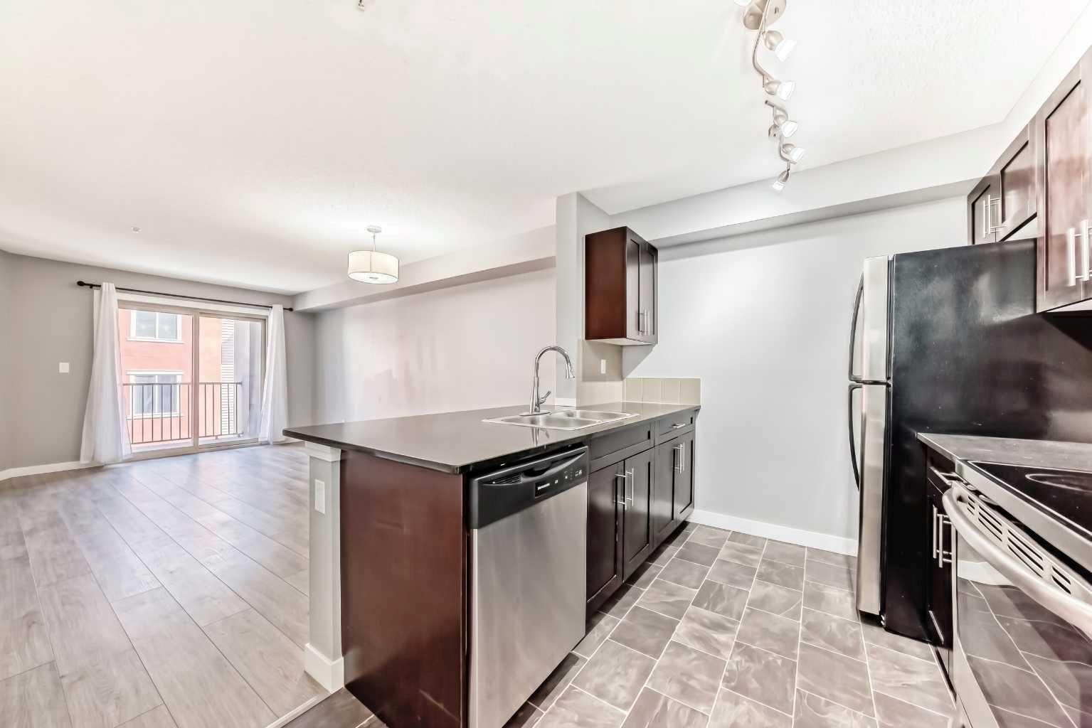 Property Photo: 403 Mackenzie Way SW 4304 AB T4B 3V7