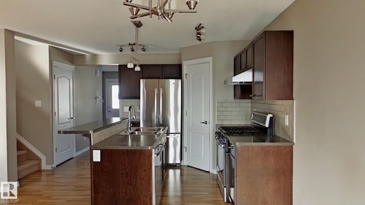 7665 Schmid Crescent NW — photo 1