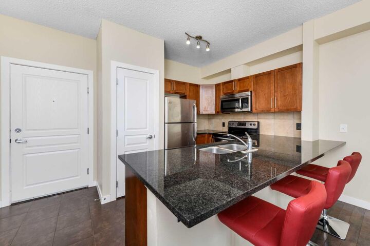 Property Photo: 22 Panatella Road NW 108 AB T3K 0V4