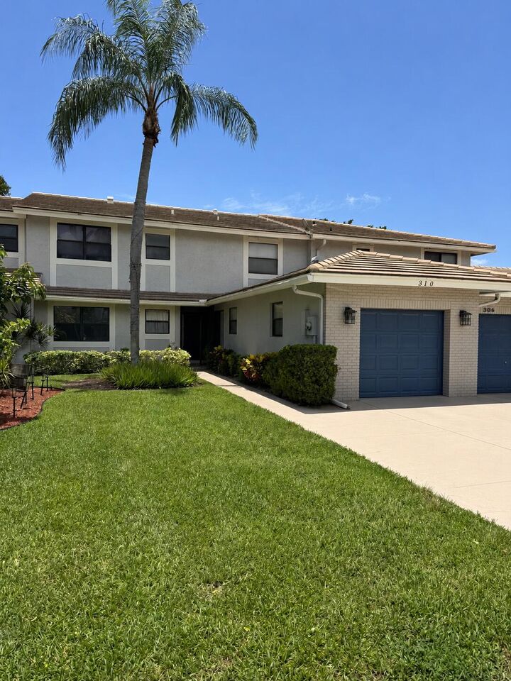 Property Photo:  310 Deer Creek Lakeside Way  FL 33442 