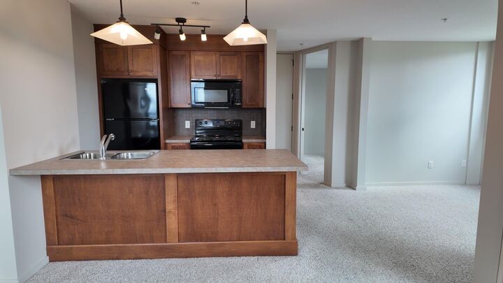 Property Photo:  105 Railway Avenue SW 1103  AB T4B 0E3 