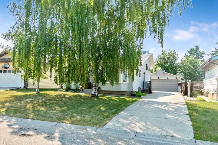 Property Photo: 163 Woodburn Crescent AB T1S 1L4