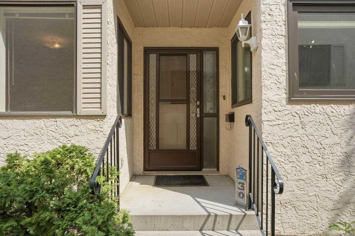 Property Photo: 30 Sandarac Circle NW AB T3K 3G7