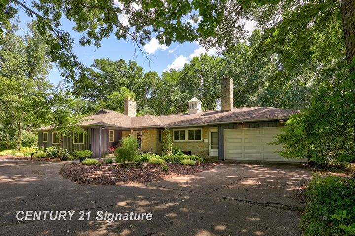 Property Photo:  1 N Center Woods Drive  MI 48638 
