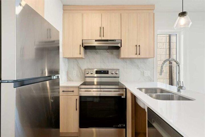 Property Photo: 156 Park Street 402 AB T4C 3H3