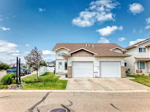 Property Photo: 6220 Orr Drive 2 AB T4P 3Z8