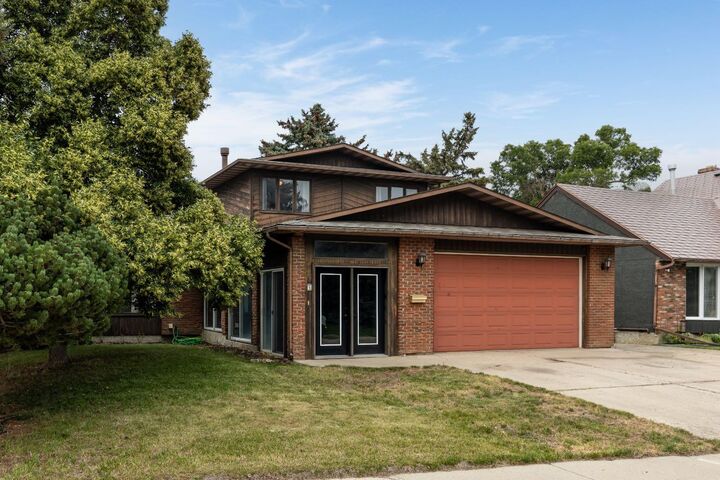 Property Photo: 4 Greenwood Court SW AB T1A 7X7