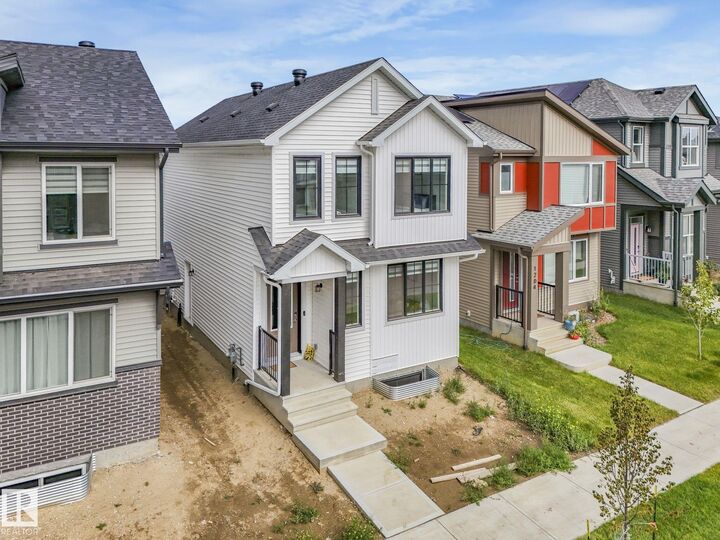 Property Photo: 1206 Keswick Drive SW AB T6W 4J9