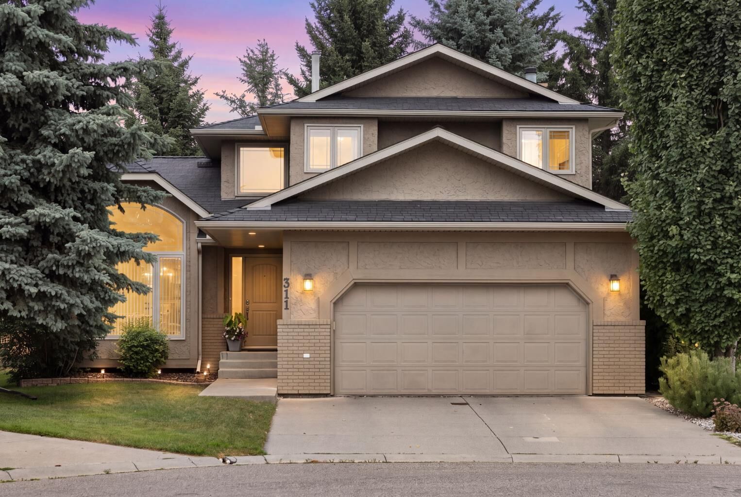 Property Photo: 311 Woodhaven Bay SW AB T2W 5S2