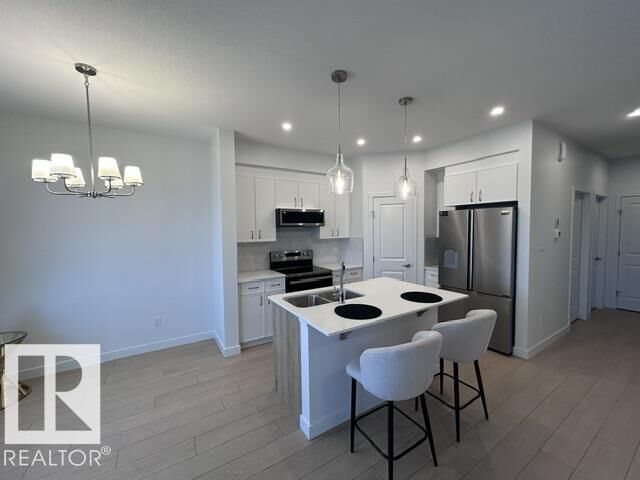 Property Photo:  20936 16 Avenue NW  AB T6M 3J4 
