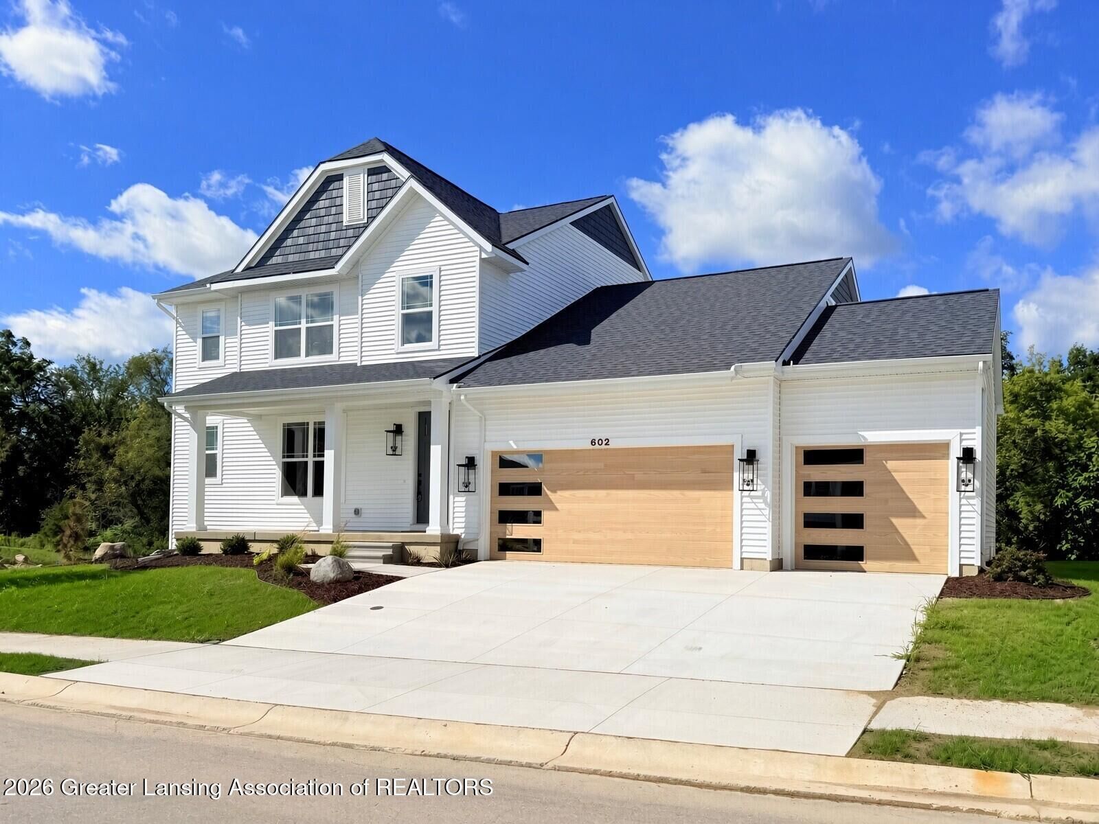Property Photo:  602 Magenta Court  MI 48840 