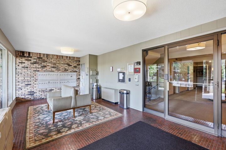Property Photo:  205 Barry Avenue S 103  MN 55391 