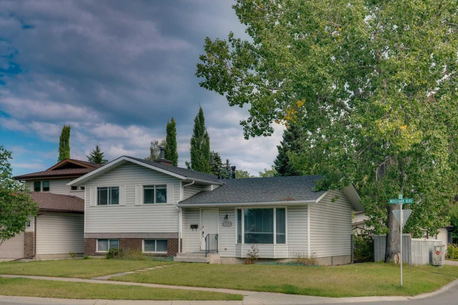 Property Photo: 703 Woodpark Boulevard SW AB T2W 3M9