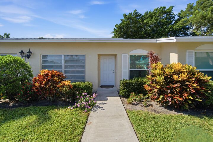 Property Photo:  13782 Vía Flora #C  FL 33484 