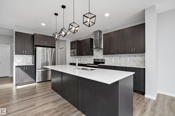Property Photo:  9227 223 Street NW  AB T5T 7M1 