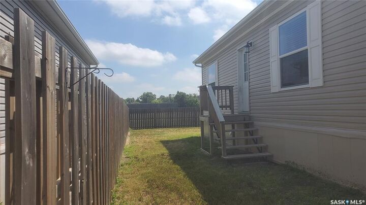 Property Photo:  210 Brownlee Street  SK S4H 3P4 