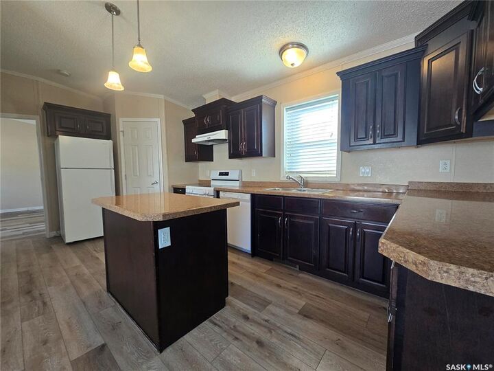Property Photo: 210 Brownlee Street SK S4H 3P4