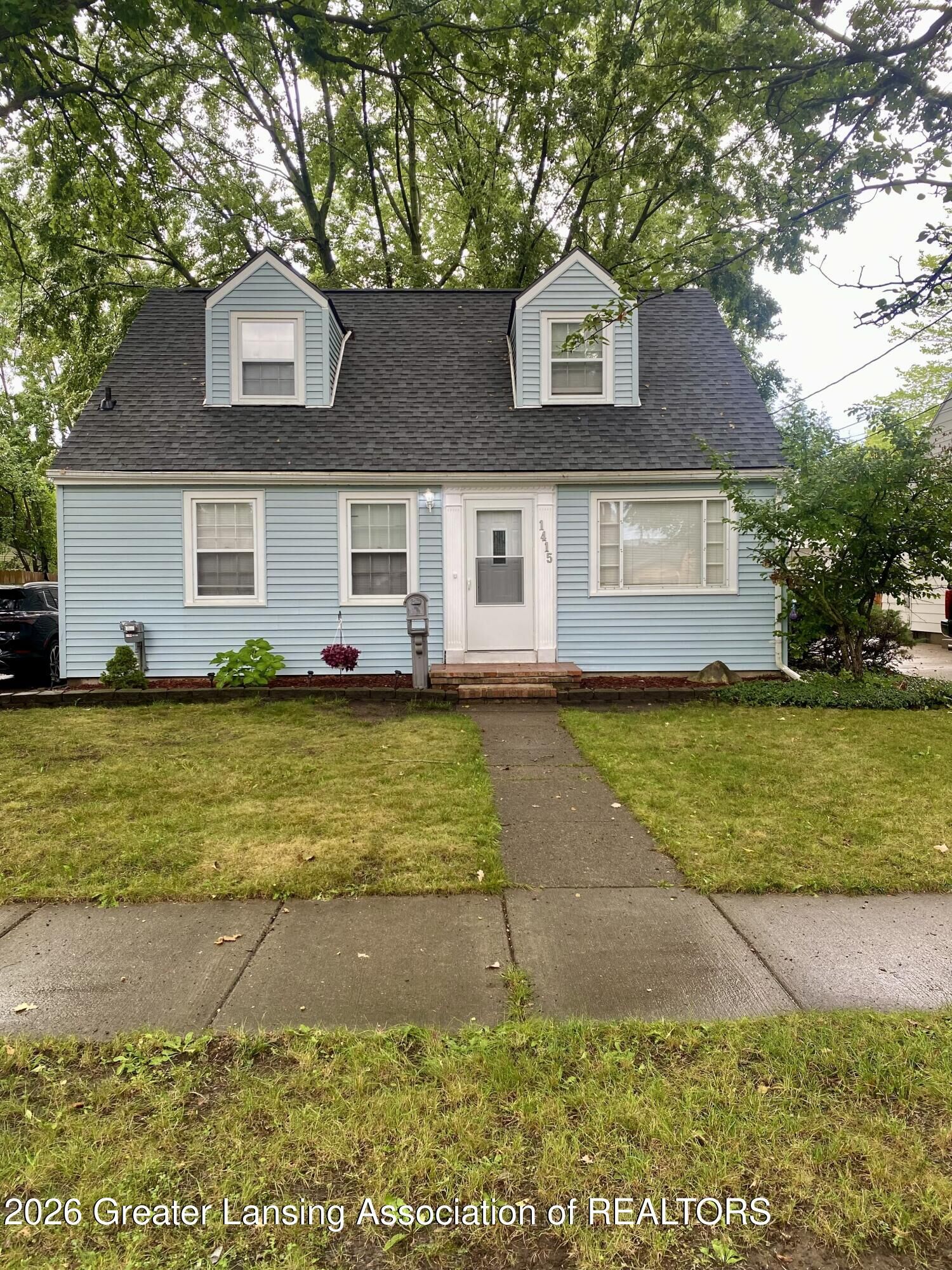 Property Photo:  1415 Poxson Avenue  MI 48910 