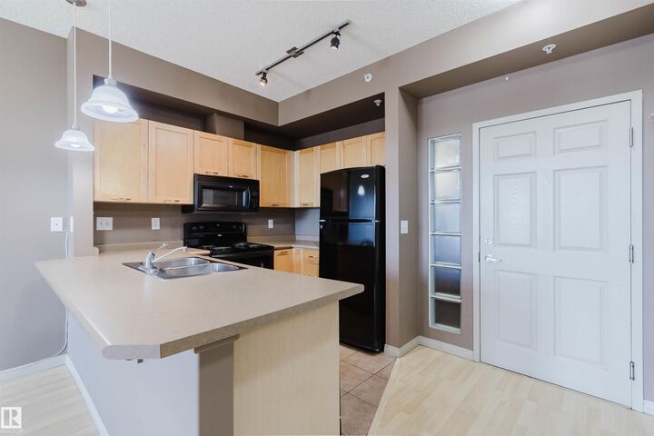 Property Photo:  4245 139 Avenue NW 1-405  AB T5Y 3E8 