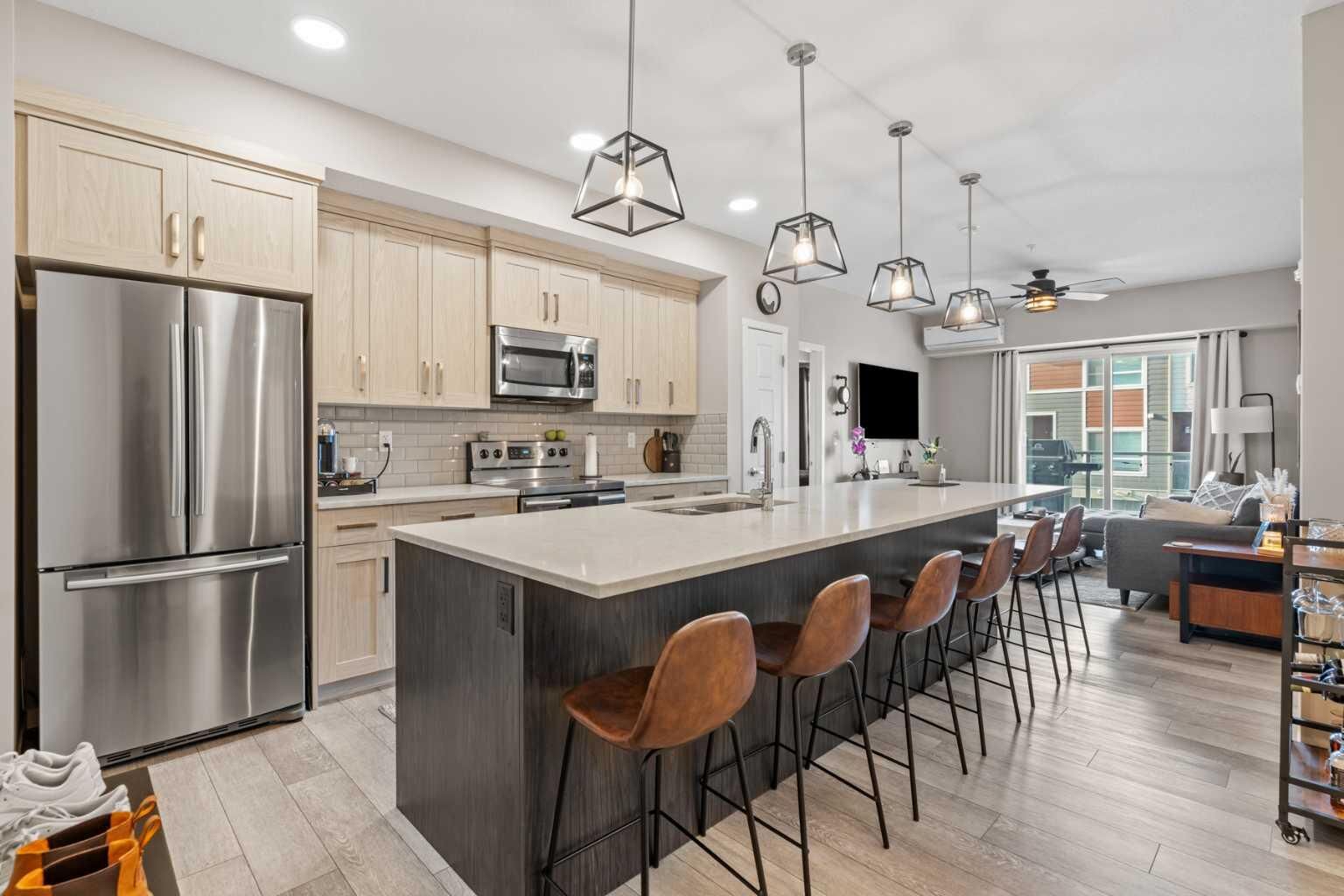 Property Photo:  370 Harvest Hills Common 205  AB T3K 2M8 