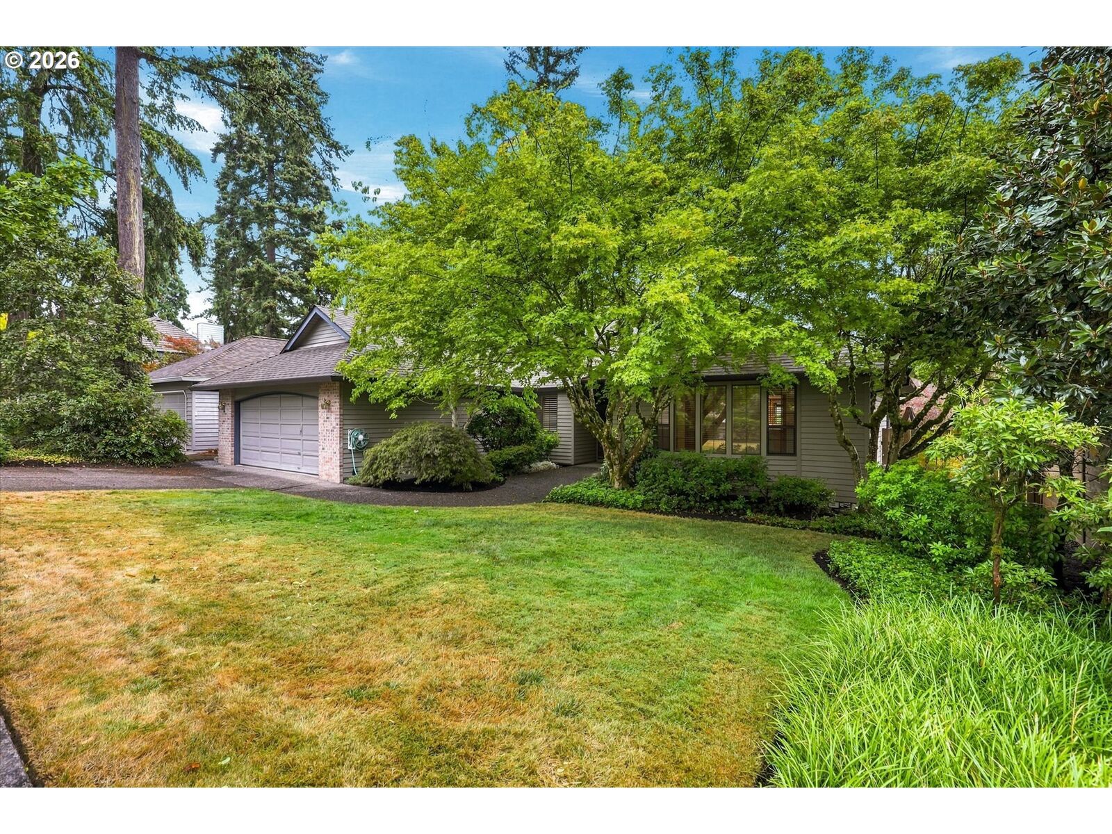 Property Photo:  6700 SW Juniper Ter  OR 97008 