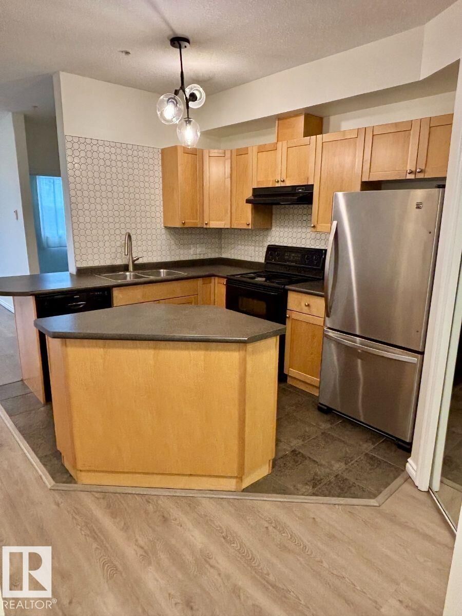 Property Photo:  10346 117 Street NW 103  AB T5K 2Y7 