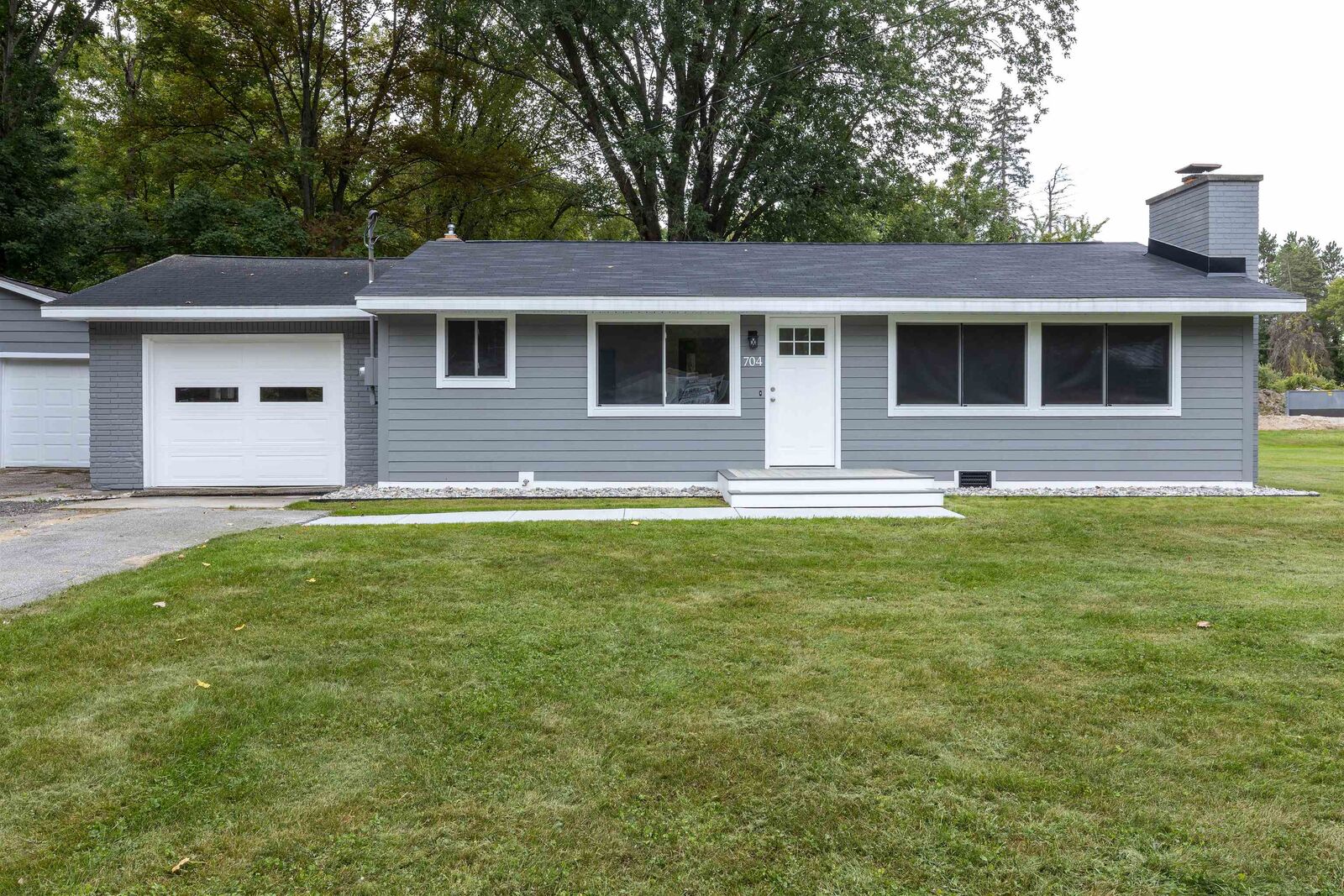 Property Photo:  704 Prairie Creek  MI 48640 