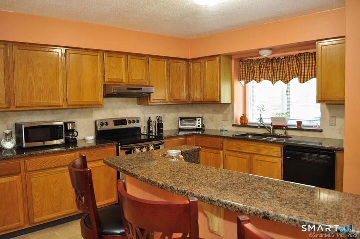 Property Photo:  605 Sand Stone Drive 605  CT 06074 